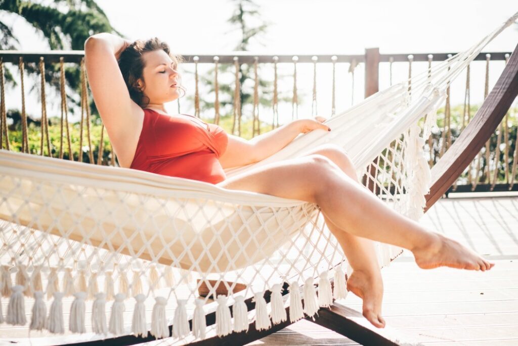 woman in hammock in swimsuit with laser hair reduction